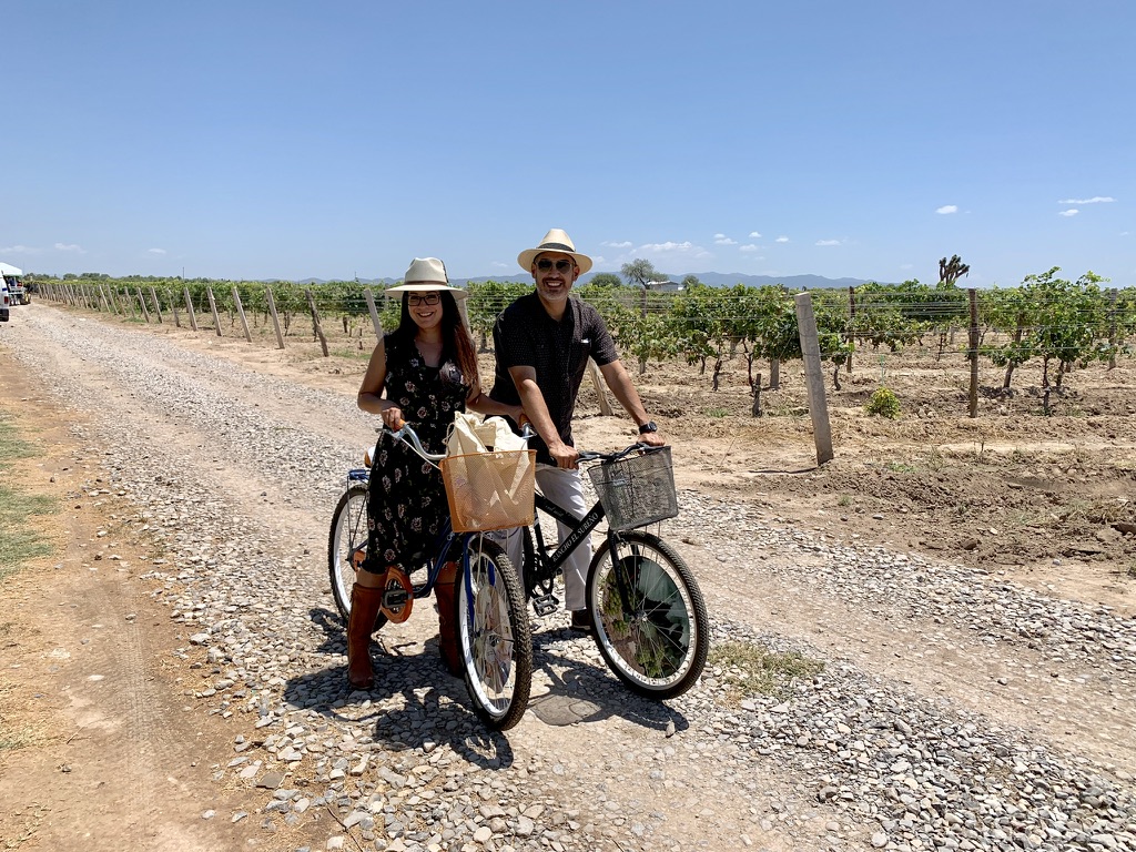Jimmy and Adrienne on bikes at the vineyard